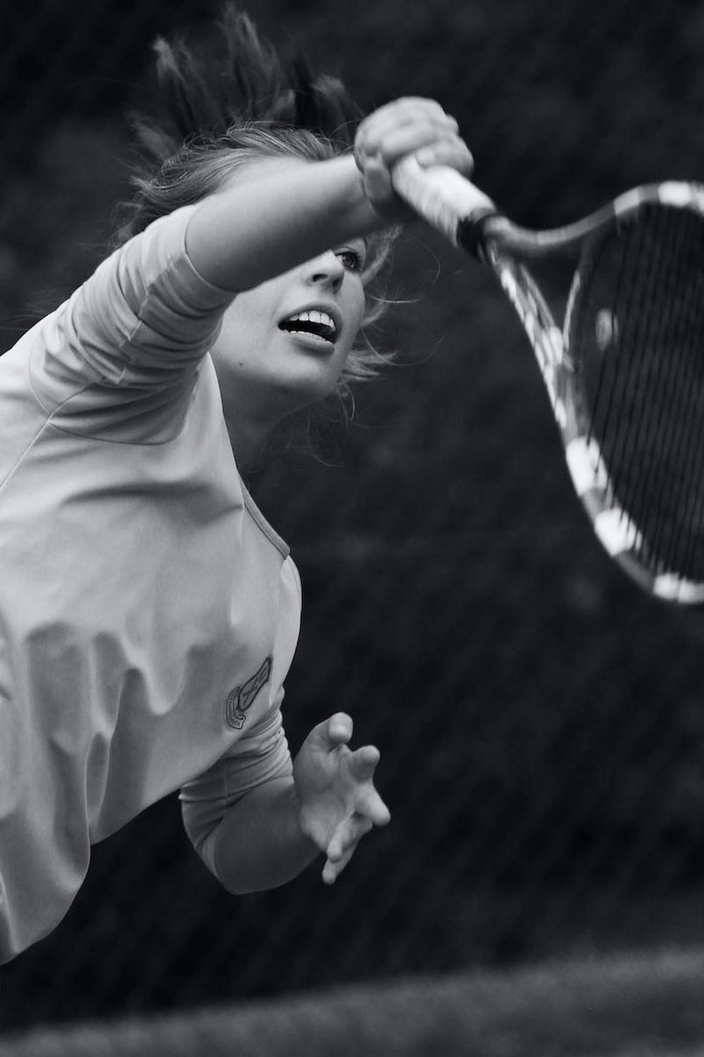 grayscale_photo_of_woman_playing_tennis