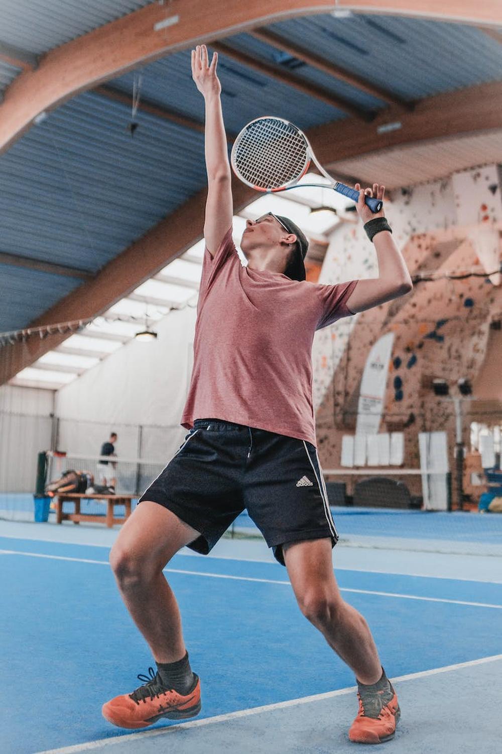 photo_of_man_playing_tennis