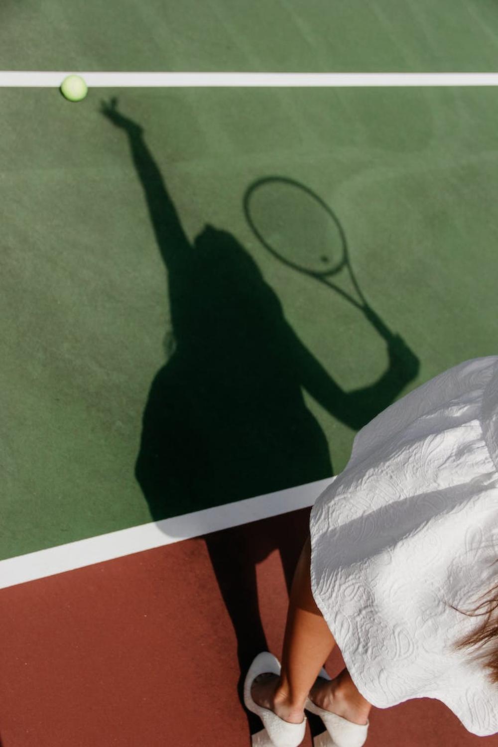 shadow_of_woman_playing_tennis