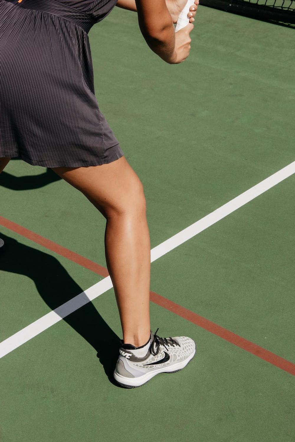 close_up_photo_of_person_playing_tennis