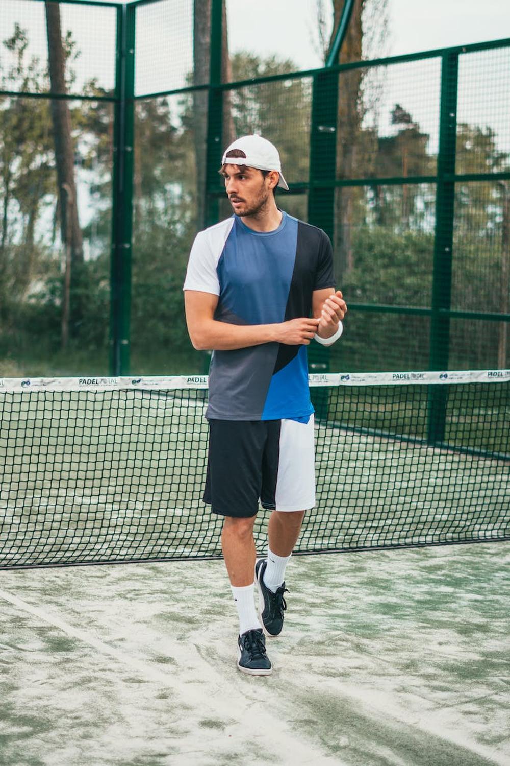 man_wearing_blue_and_white_crew_neck_shirt_and_sho