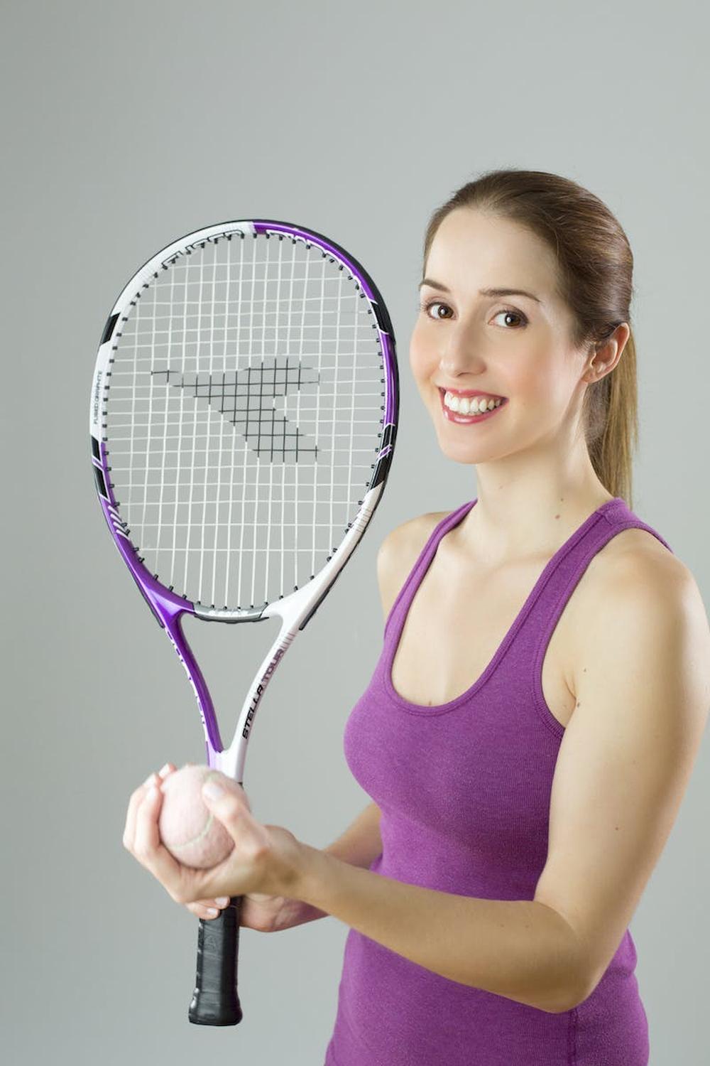 woman_wearing_purple_tank_top_holding_purple_and_w